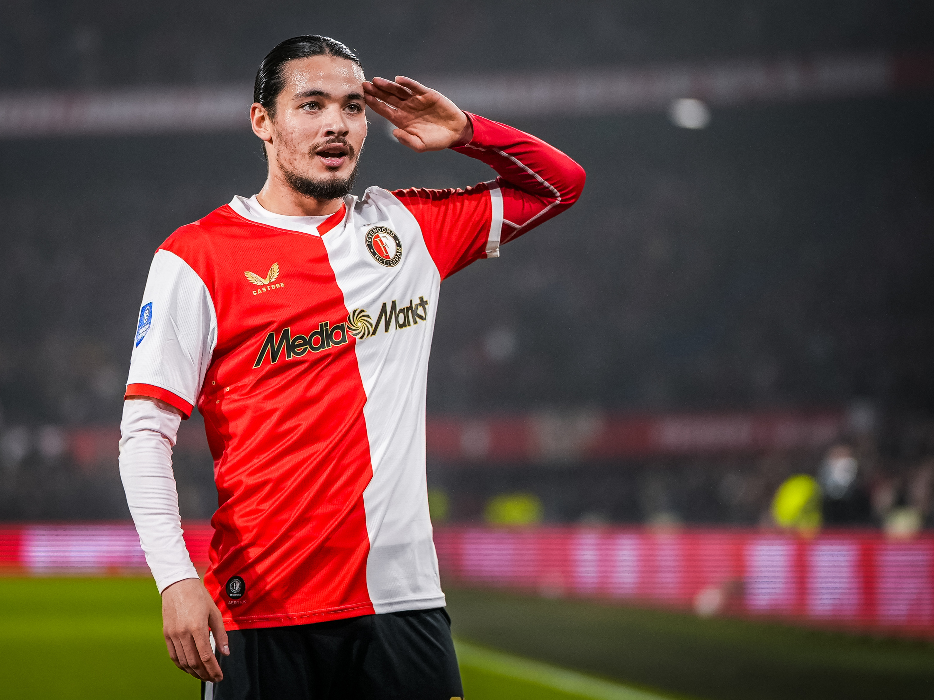 Anis Hadj Moussa in a Feyenoord home shirt saluting the De Kuip crowd